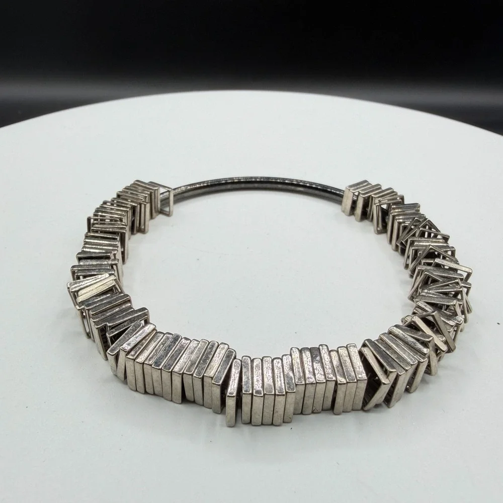 N/A sculptural silver
